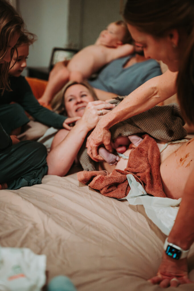 everyone looking at brand new baby