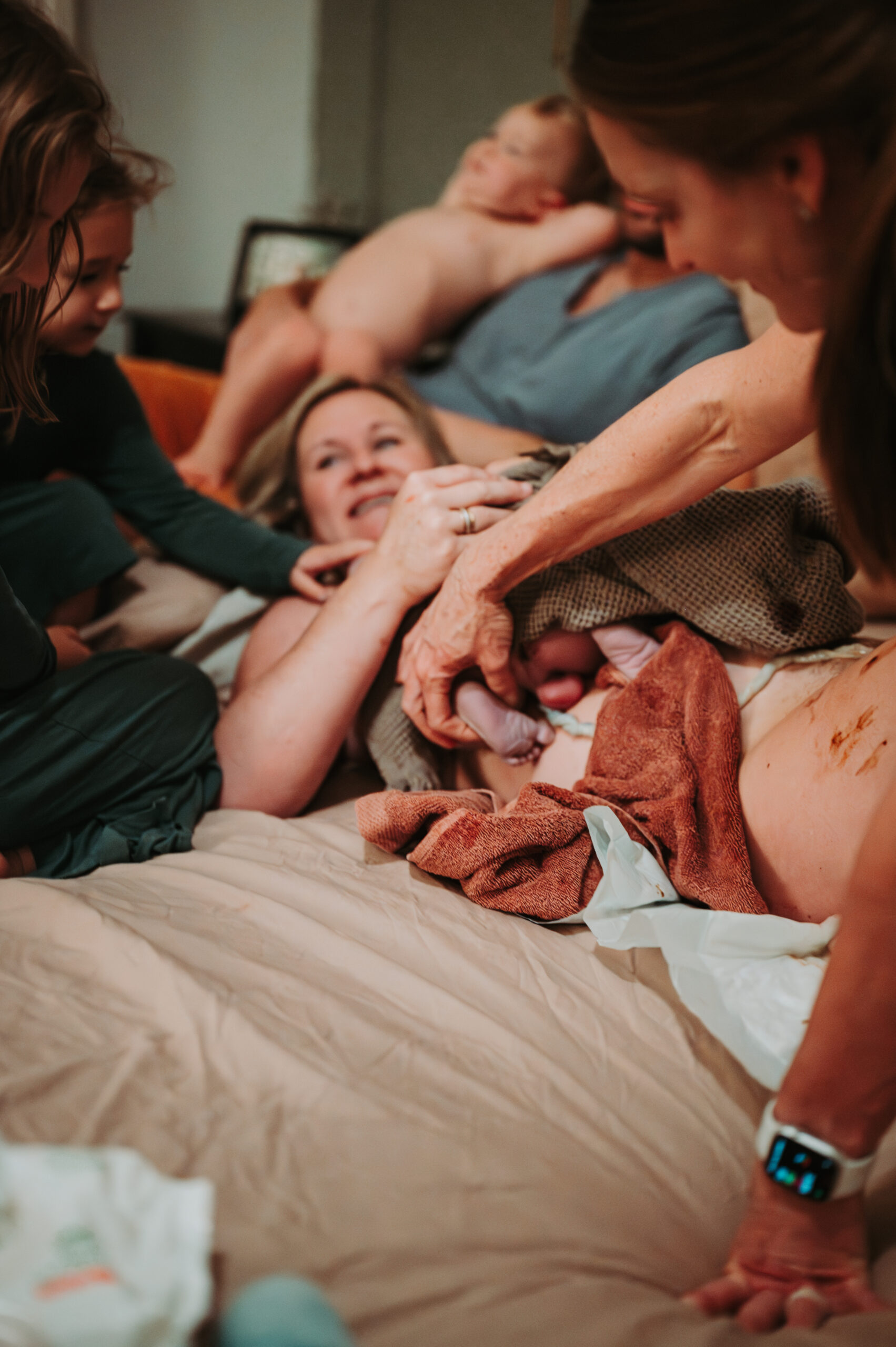 everyone looking at brand new baby