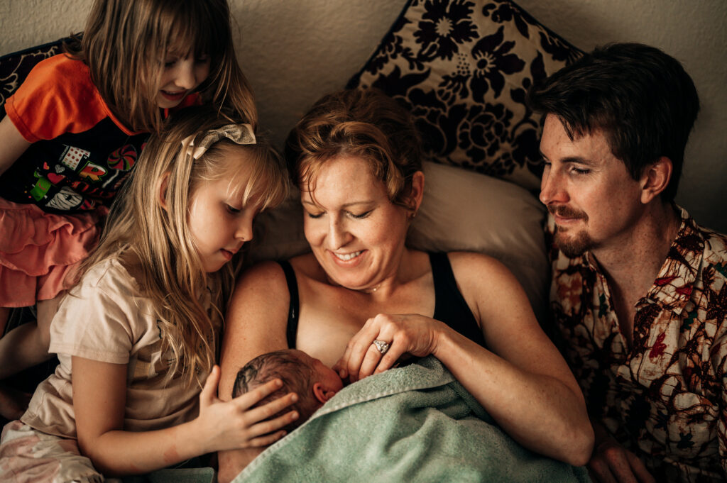 Newborn baby photographed in first moments of life by DFW birth photographer Emily King Poppy Blue Photography Fort Worth Texas